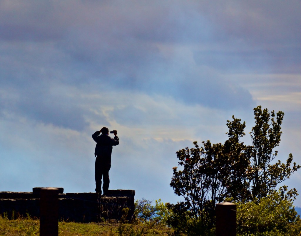 Some random visitor to Halemaumau Crater getting some video of the smoke rising from the vent. Overcast on this New Year's Day. Photo by Baron Sekiya